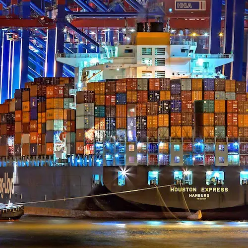 Picture of the shipping pier of our shipping services. we ship product, packaging and display. Wes hip under DDP, DAP or DDU eco-term. This picture is a boat full of containers